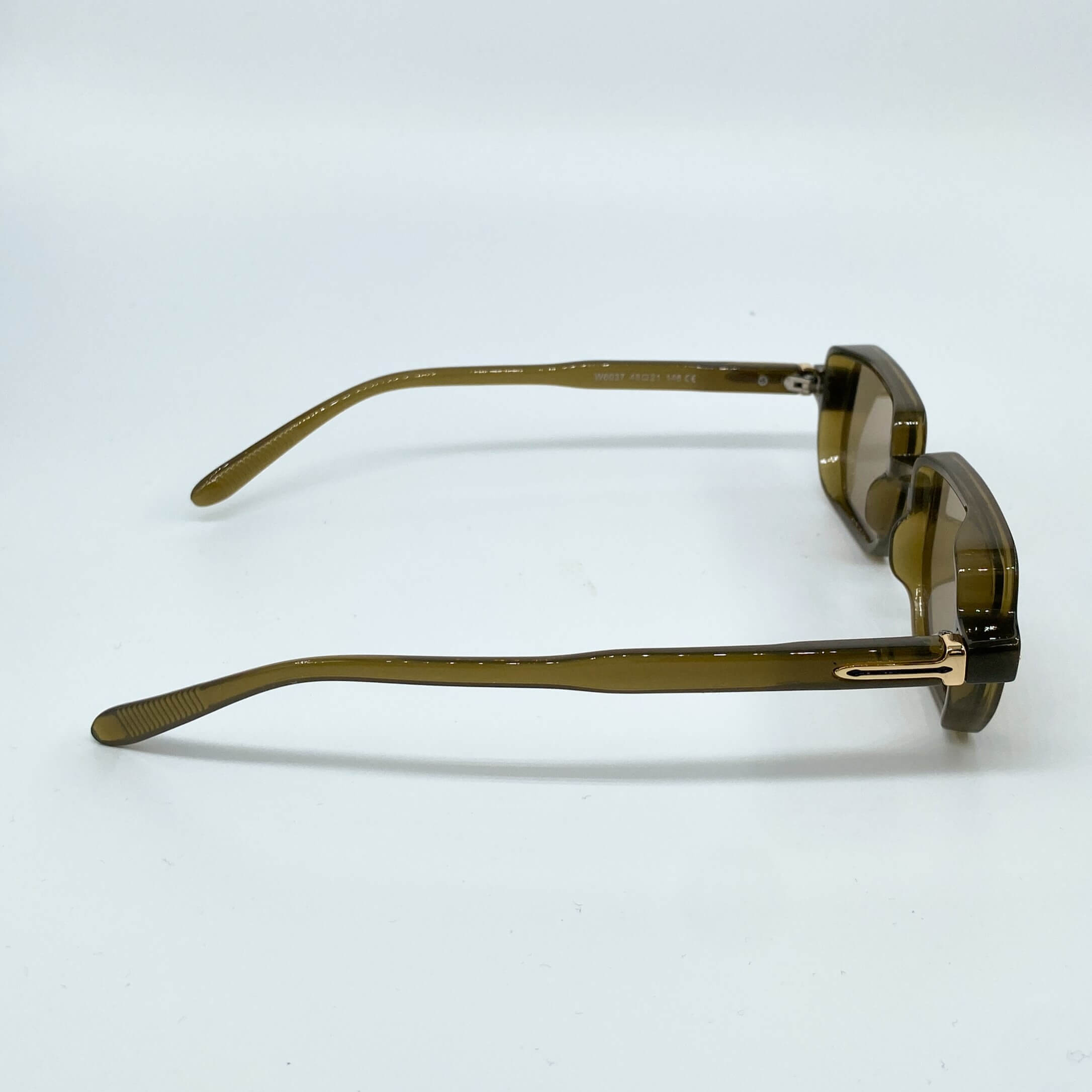 Maya narrow rectangular sunglasses with a translucent green frame and brown lenses for a retro-modern urban and festival look - Party People