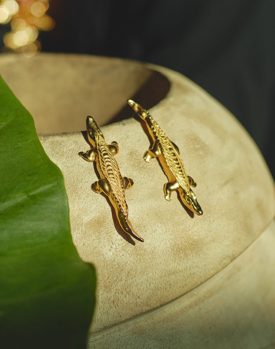 Close-up of unique handcrafted gecko-shaped statement earrings, 24k gold or 925 silver plated and nickel-free, by Party People.