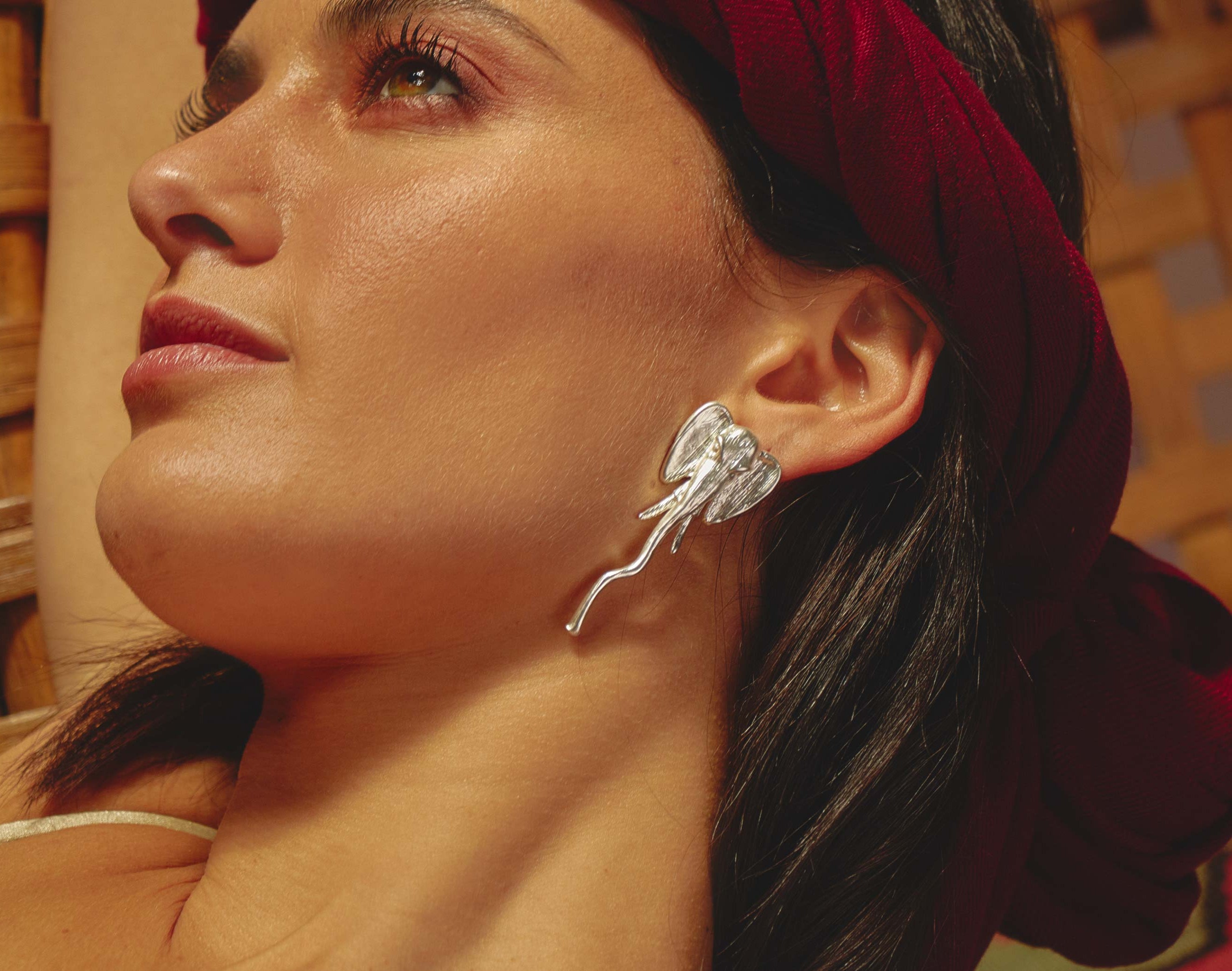 Close-up of handcrafted 3D elephant-shaped statement earrings, unique artisanal jewelry for everyday wear and festivals by Party People.