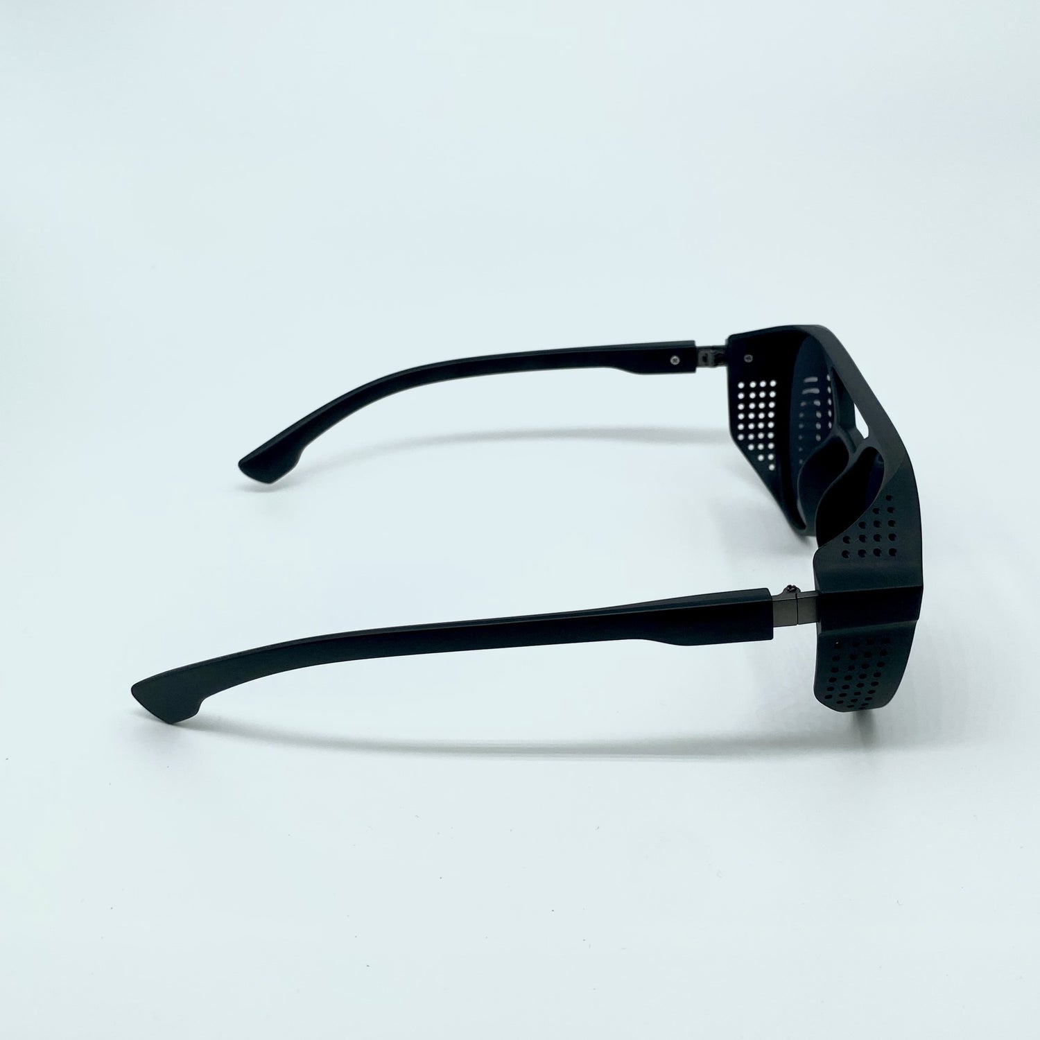 Danny narrow rectangular sunglasses with a slim frame and dark lenses for a retro-inspired urban and festival aesthetic - Party People.